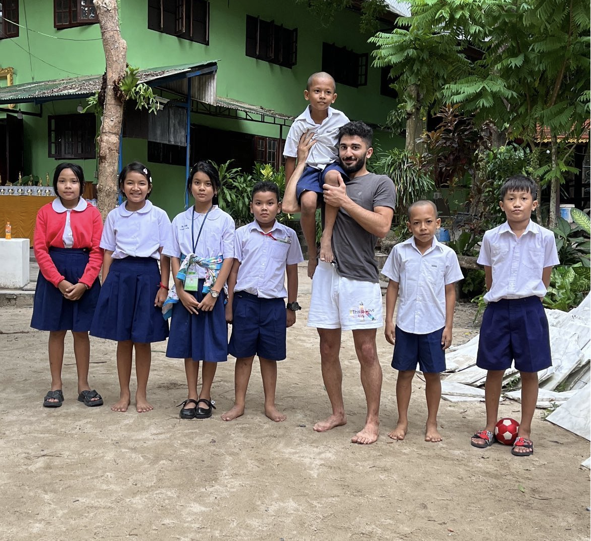 Robin giving back with children